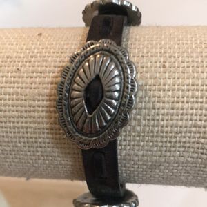 Leather and silver concho bracelet.